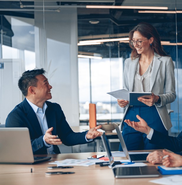 Two colleagues talking in an office.